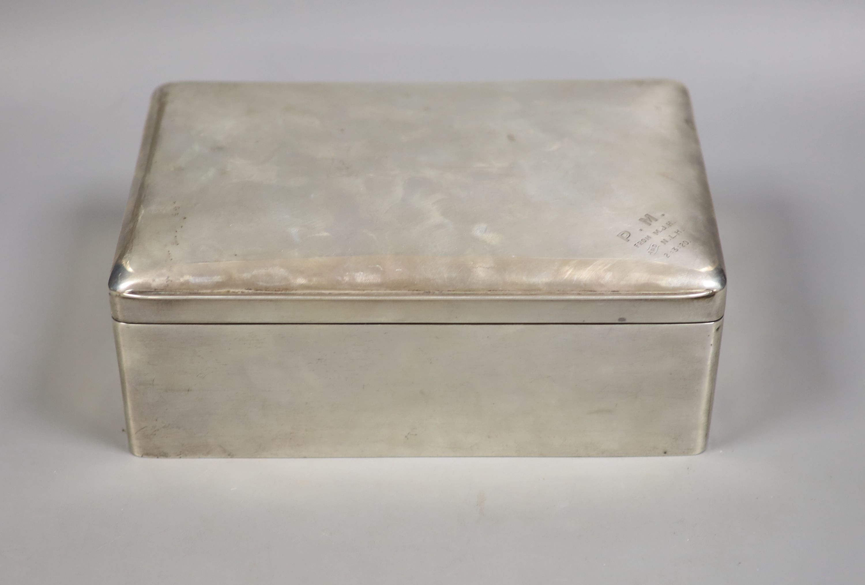 An Edwardian silver mounted rectangular cigar box, Stokes & Ireland Ltd, Chester, 1907, with later engraved inscription, 23.8cm, gross weight 50.5oz.